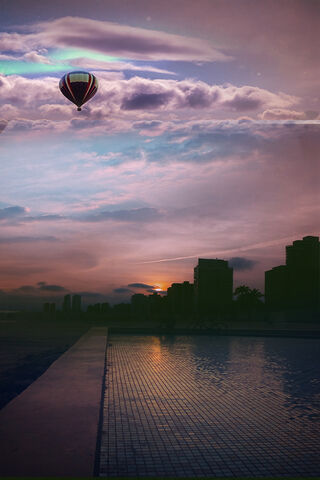 Sunset Serenity: A Balloon's Journey Over the Beach 🌅🎈