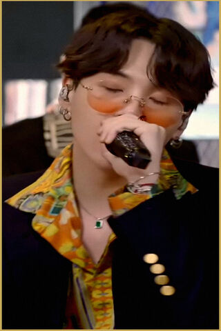 Suga's Vibrant Performance: A Moment in Music 🎤✨