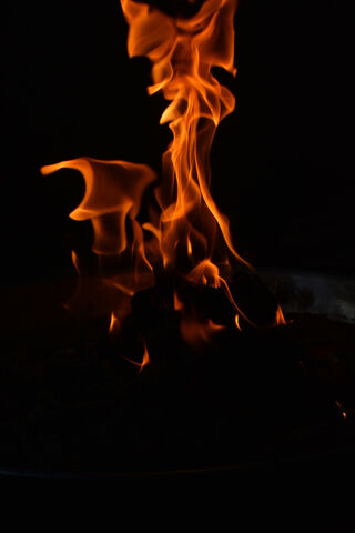 Dancing Flames: A Night's Embrace 🔥🌌