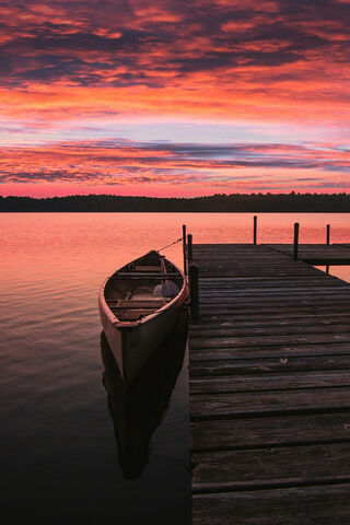 Serenity at Dusk: The Lone Boat