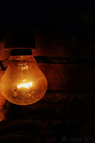 Glow of Inspiration: The Bulb's Warm Embrace 💡✨