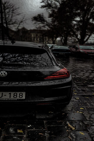 Sleek and Stylish: The Volkswagen Scirocco in the Rain 🌧️🚗