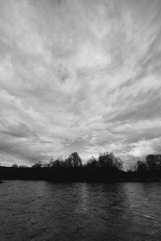 Monochrome Serenity: A River's Reflection