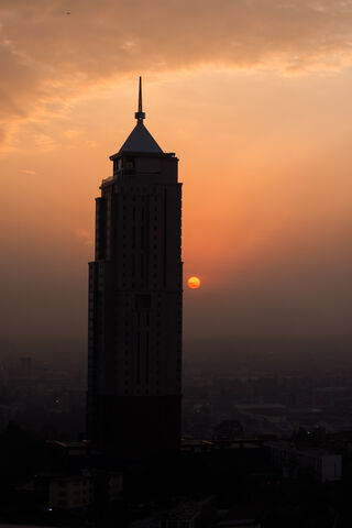 Silhouette of Shadows: The Dark Building at Dusk