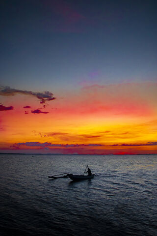 Sunset Serenity: The Life of a Local Fisherman 🌅🎣