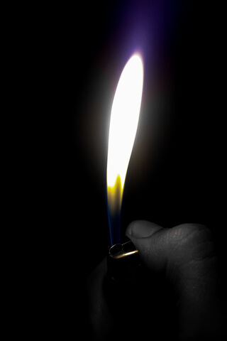 Ignite the Night: A Lighter's Flame