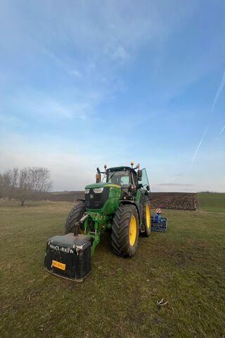 Power and Precision: The John Deere 6195M in Action 🚜🌾