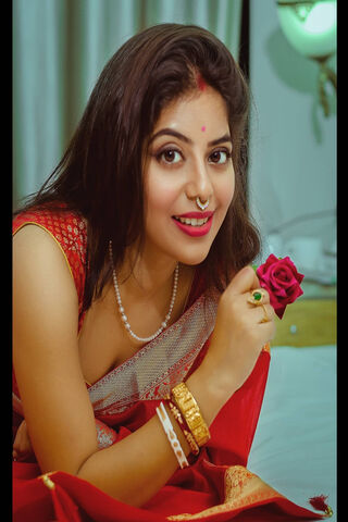 Elegance in Red: Sayani Saha's Graceful Charm