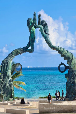 Embrace of the Caribbean: Playa Del Carmen's Iconic Sculpture 🌊✨