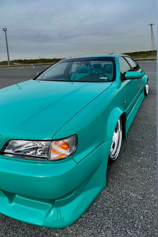 Sleek and Stylish: The Nissan Maxima in Aqua