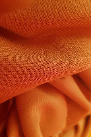 Vibrant Orange Delight: The Essence of Fabric