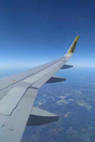Soaring High: A Glimpse from Above ✈️🌤️