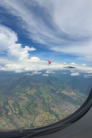 Skyward Serenity: A Glimpse from Above 🌤️✈️