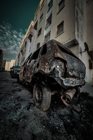 Ashes of the Past: A Burned Car's Tale