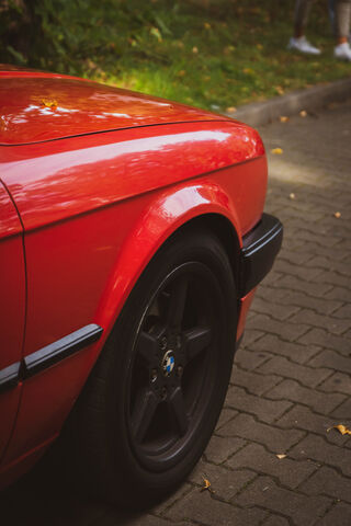 Sleek Red BMW: A Classic Beauty on Black Wheels 🚗❤️
