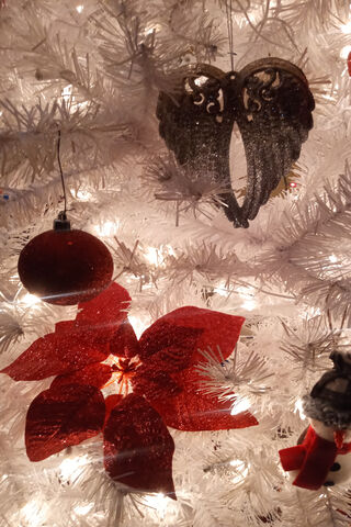 Whispers of the Holidays: Angel Wings Adorn the Tree