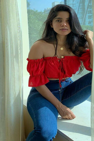 Radiant Charm: Divya Bharathi in Red