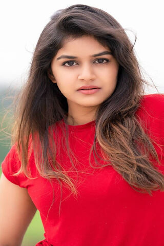 Radiant Charm: Sanjana Anand in Red