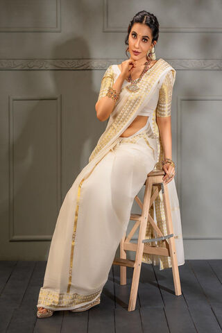 Elegance in White: Parvati Nair's Timeless Charm