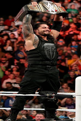 Champion's Glory: Roman Reigns Raises the WWE Title! 🏆💪