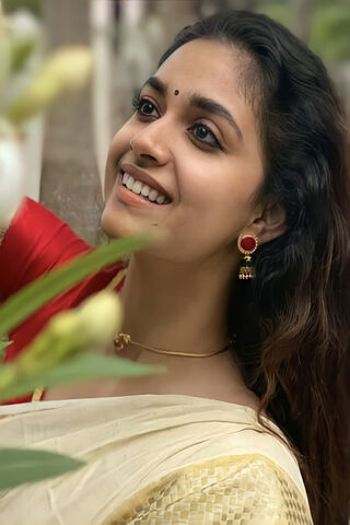 Radiant Elegance: Keerthi Suresh in Nature's Embrace 🌼
