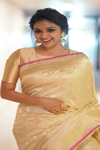 Elegance in Tradition: Keerthy Suresh Shines in a Golden Saree