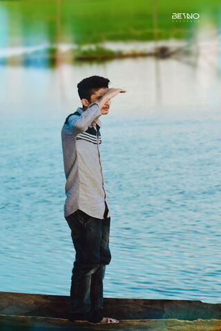 Ihm Iqbal: A Moment of Reflection by the Water 🌊