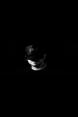 The Enigmatic Residente: A Shadowed Icon 🎤✨