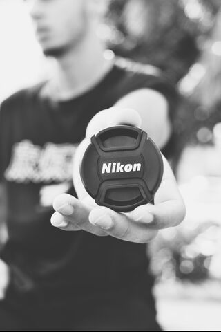 Capture the Moment: Nikon Lens Cap in Focus 📸