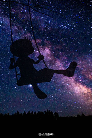 Starlit Dreams: A Child's Swing Through the Cosmos