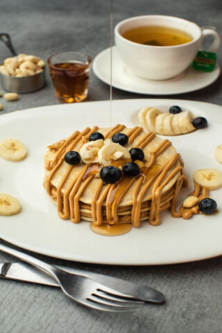 Deliciously Drizzled Pancake Delight! 🥞✨