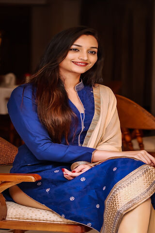 Elegance in Blue: A Portrait of Grace