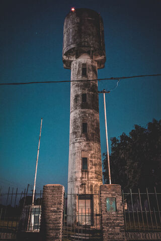 Twilight Sentinel: The Water Tower at Dusk