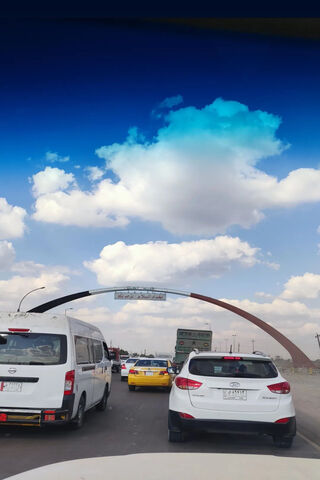 Gateway to Baghdad: A Journey Begins 🚗🌆