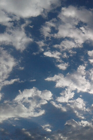 Whispers of the Sky: A Cloudy Blue Canvas