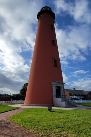 Beacon of Hope Under a Blue Sky 🌤️