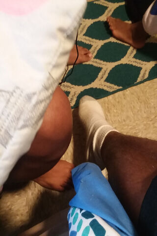 A Cozy Moment: Feet and Legs in Relaxation