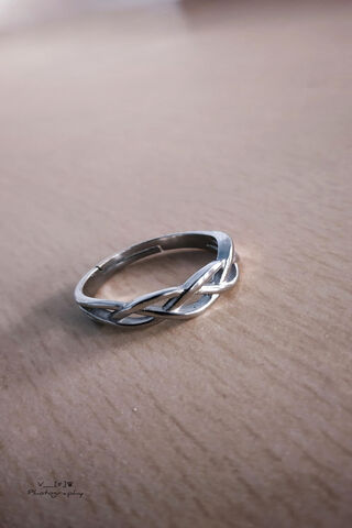 Intertwined Elegance: A Silver Ring Story