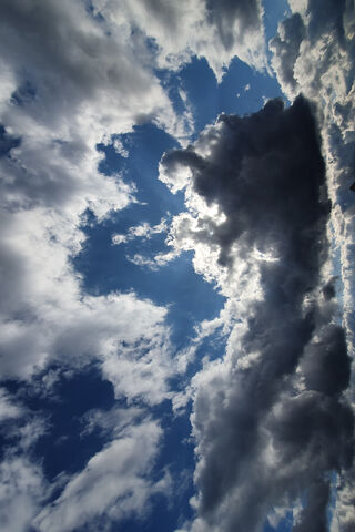 Serene Skies: A Dance of Light and Clouds