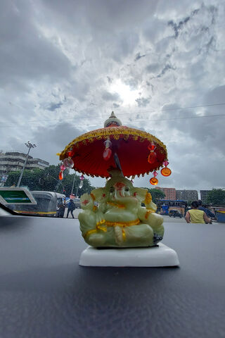 Divine Blessings: Ganapathi Bappa Under the Sky 🌧️✨