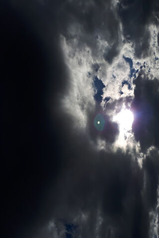 Radiant Glow Behind the Clouds ☀️☁️