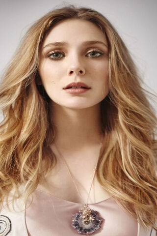 Radiant Elegance: The Allure of Elizabeth Olsen ✨