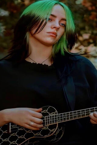 Billie Eilish: Strumming to Her Own Beat 🎶💚