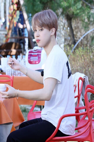 A Moment of Joy: Jimin Enjoying a Meal 🍽️
