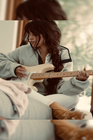 Strumming Serenity: Camila's Musical Moment 🎸✨