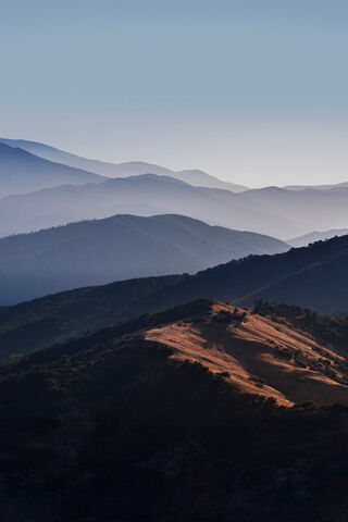 Dawn's Embrace Over the Peaks 🌄
