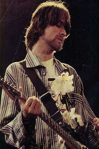 The Soulful Strum: Kurt Cobain in the Spotlight 🎸✨