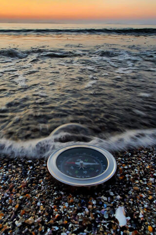 Guiding Light: The Compass by the Shore 🌅🧭