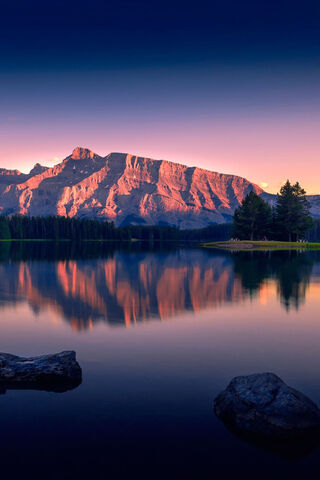 Serenity at Dawn: A Mountain Reflection