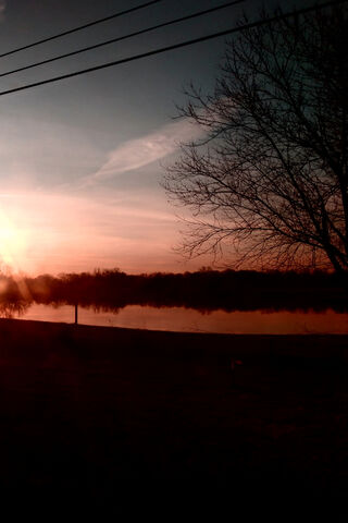 Morning Glow Over Tranquil Waters 🌅